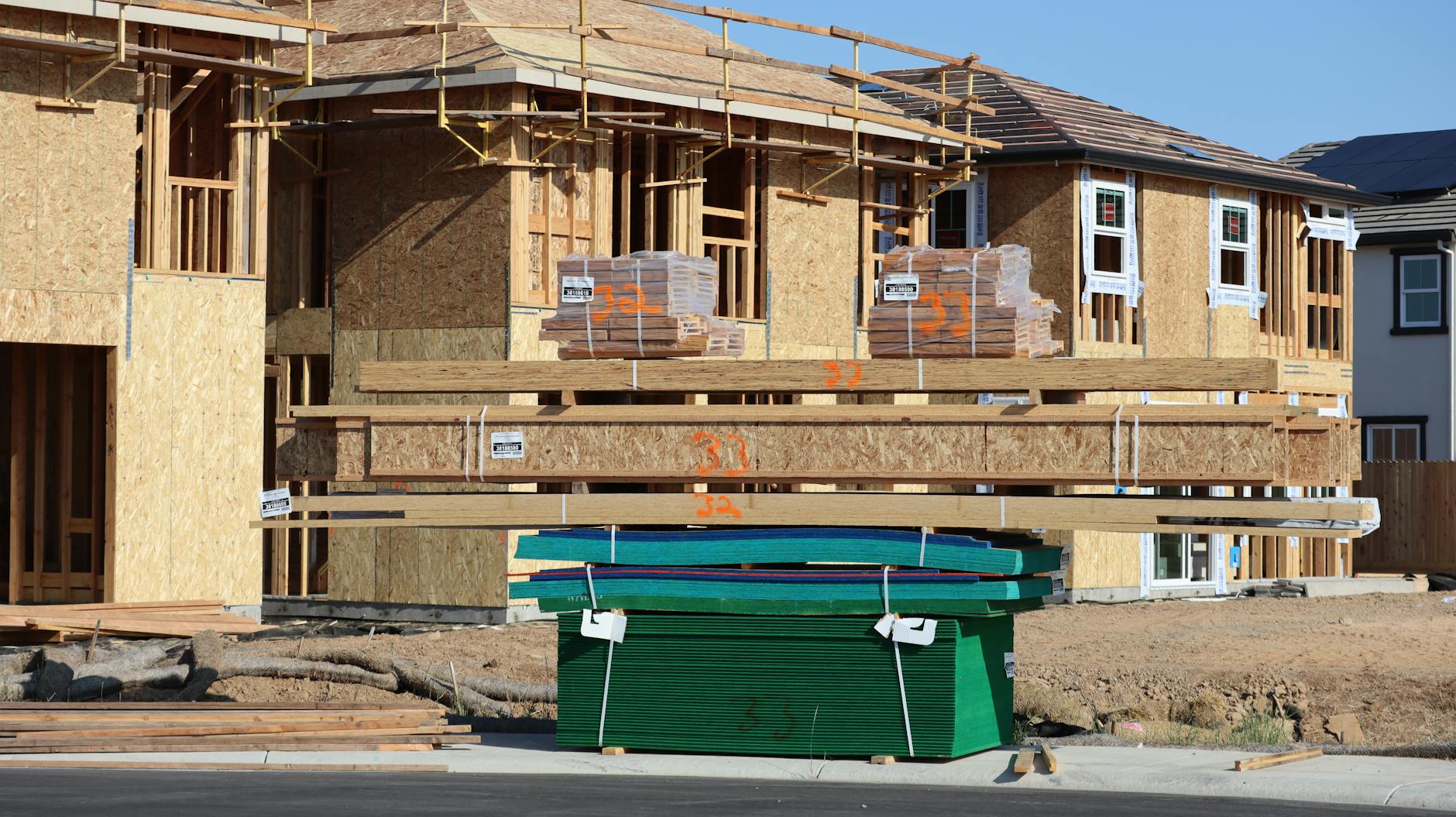 Wood frames and materials at a construction site for new homes in Elk Grove, California.